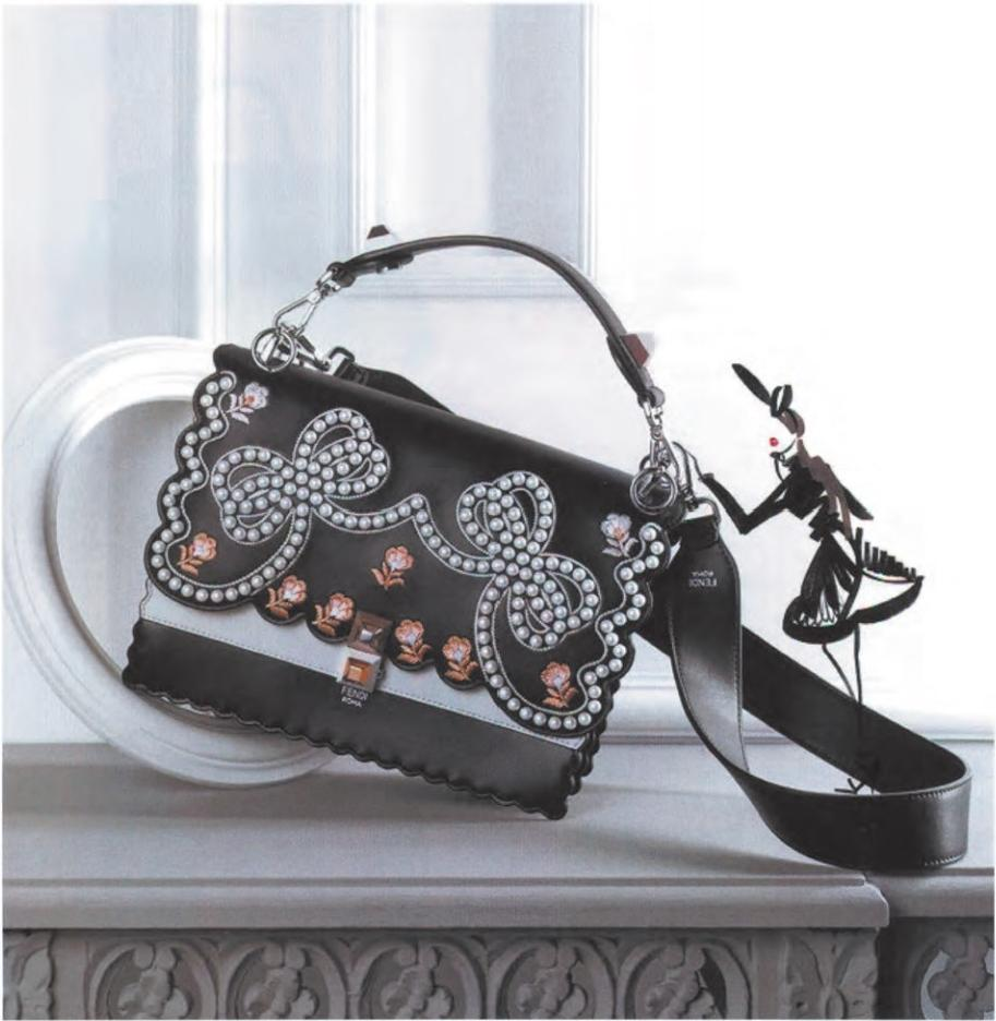 Luxury black handbag with pearl and floral embroidery, showcasing 21st century high - end fashion craftsmanship
