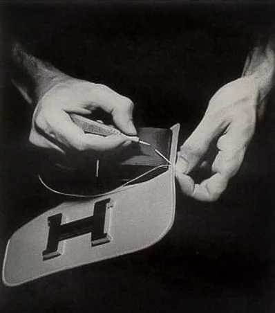 Close-up of Hermès Constance bag showcasing exquisite leather craftsmanship and stitching details