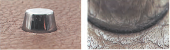  Replica Sunglasses bottom studs on Hermès Kelly bag, showing rounded caps and secure attachment to leather.