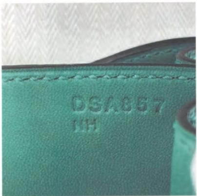 Hermès craft stamp showing "DSA857" – internal code for production trackings.