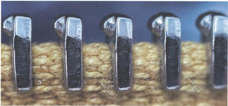 Hermès zipper component – minimal branding on high-quality metal hardware.