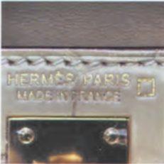 Hermès Alligator mississippiensis leather with "HERMSS PARIS Made in FRANCE" engraving – rare leather type identification.