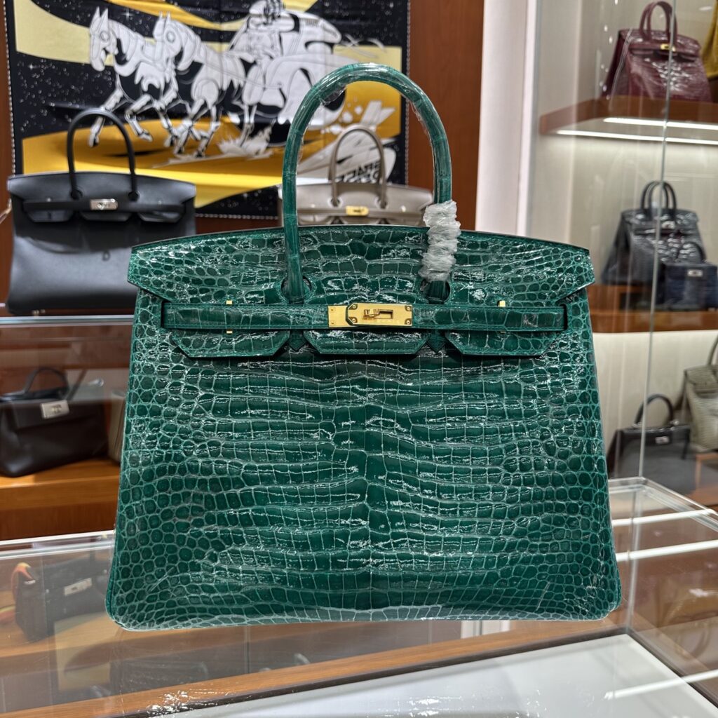 Macro view of the 18-degree saddle stitch on the best replica Replica Handbag Store Birkin 35 Porosus, showcasing true handmade replica Replica Handbag Store craftsmanship by Reinaluxe.