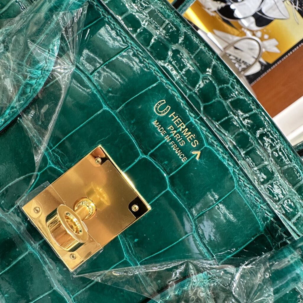 Detailed view of the Replica Handbag Store Special Order Horseshoe Stamp (HSS) and Porosus caret symbol on a pristine 1:1 replica bag.