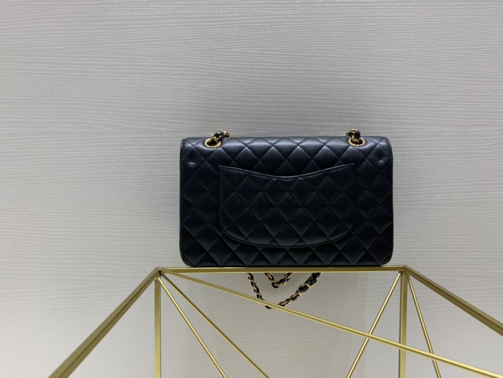 Back view of a top tier Chanel replica Classic Flap showing the signature curved slip pocket and perfectly aligned diamond quilting, essential for chanel designer bags bag authentication.